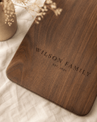 Large walnut cutting board with custom family name engraving