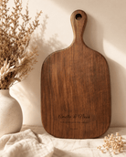 Custom walnut cutting board personalized for weddings and families