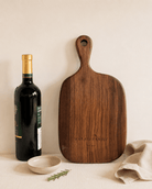 Personalized walnut cutting board styled for family kitchen decor